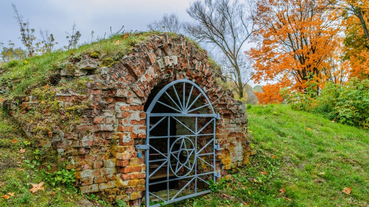 old hillside root cellar with wrought iron doors