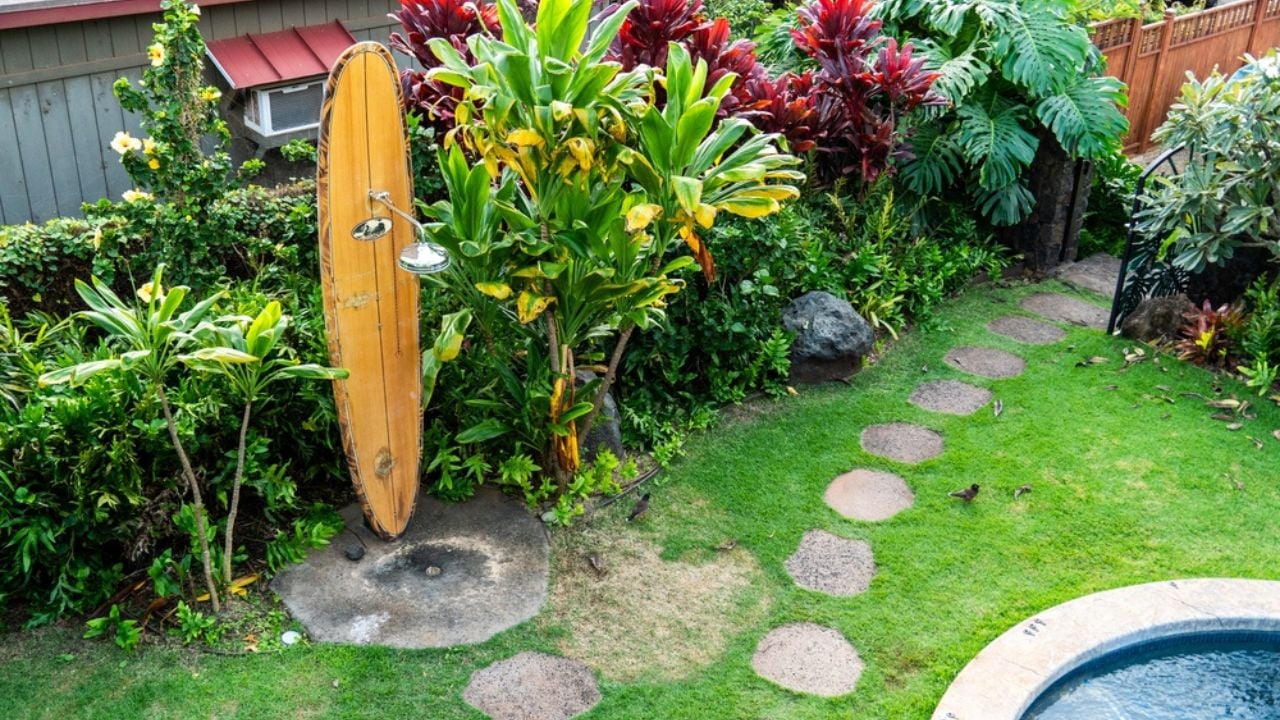 A beach house in hawaii with an outdoor shower