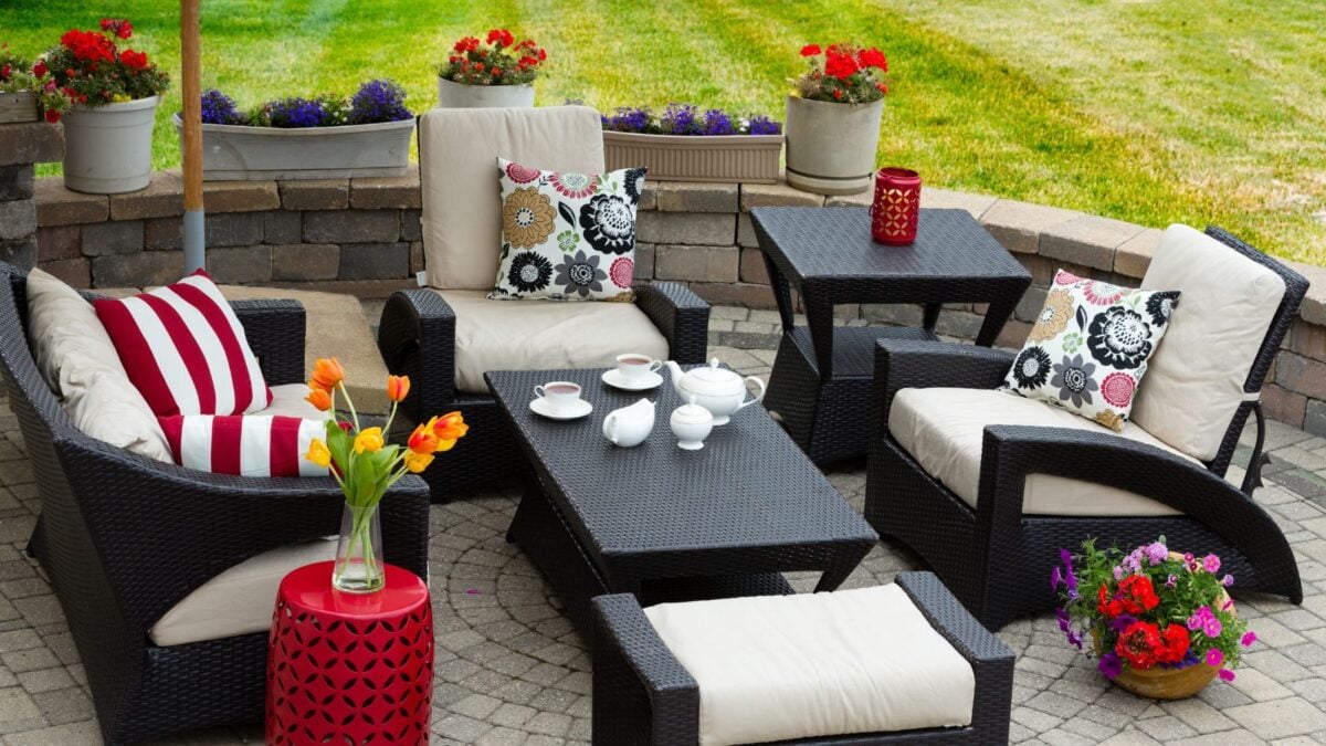 cozy patio furniture with red color accents.