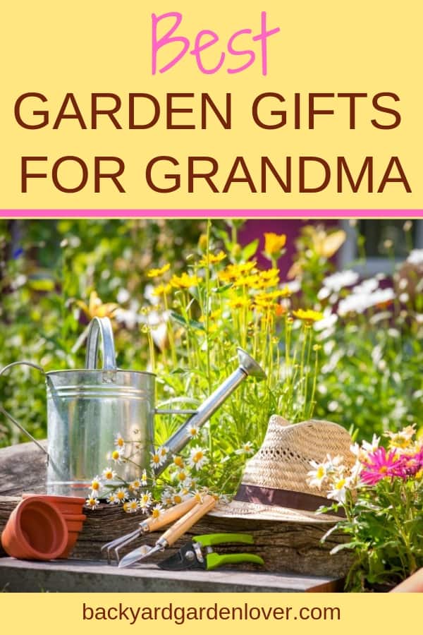 Garden tools in front of a flower garden