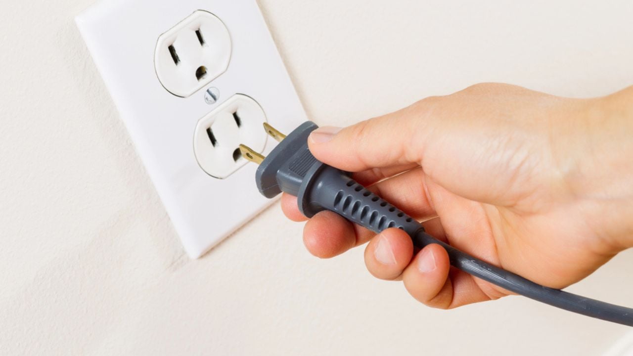 Inserting Power Cord Receptacle in Wall Outlet