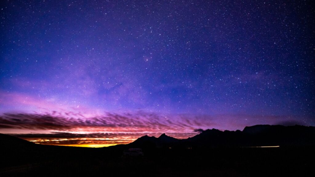 Orange Sunlight Illuminates Night Sky Big Bend National Park