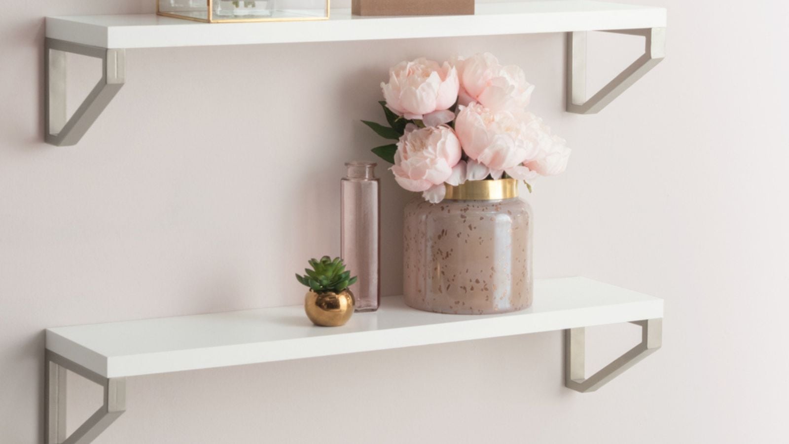 Pink Flowers and Floral Arrangements on White Floating Shelves in Bright Living Room with Light Pink Walls, Copy Space