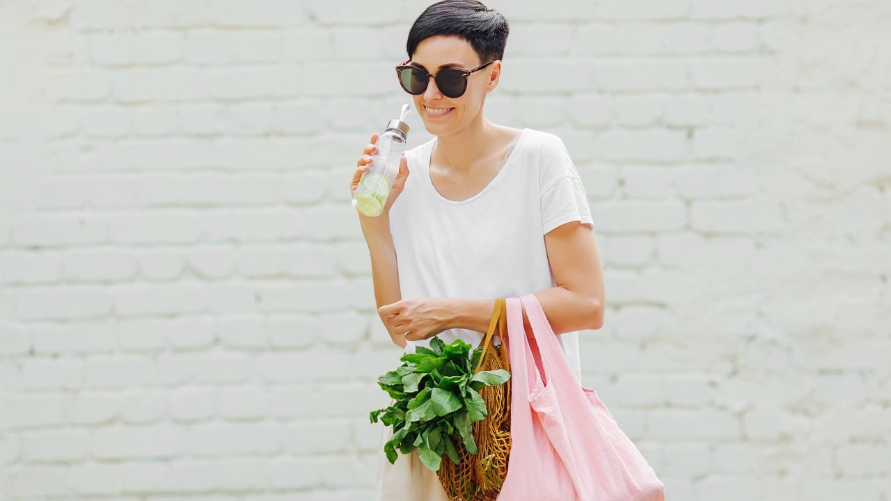 A woman with a reusable shopping bag.