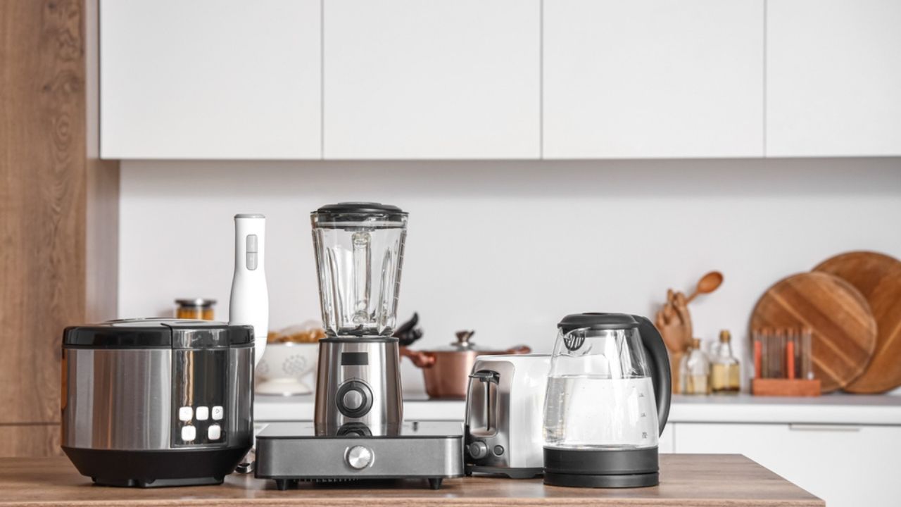 Set of appliances on wooden table in contemporary kitchen