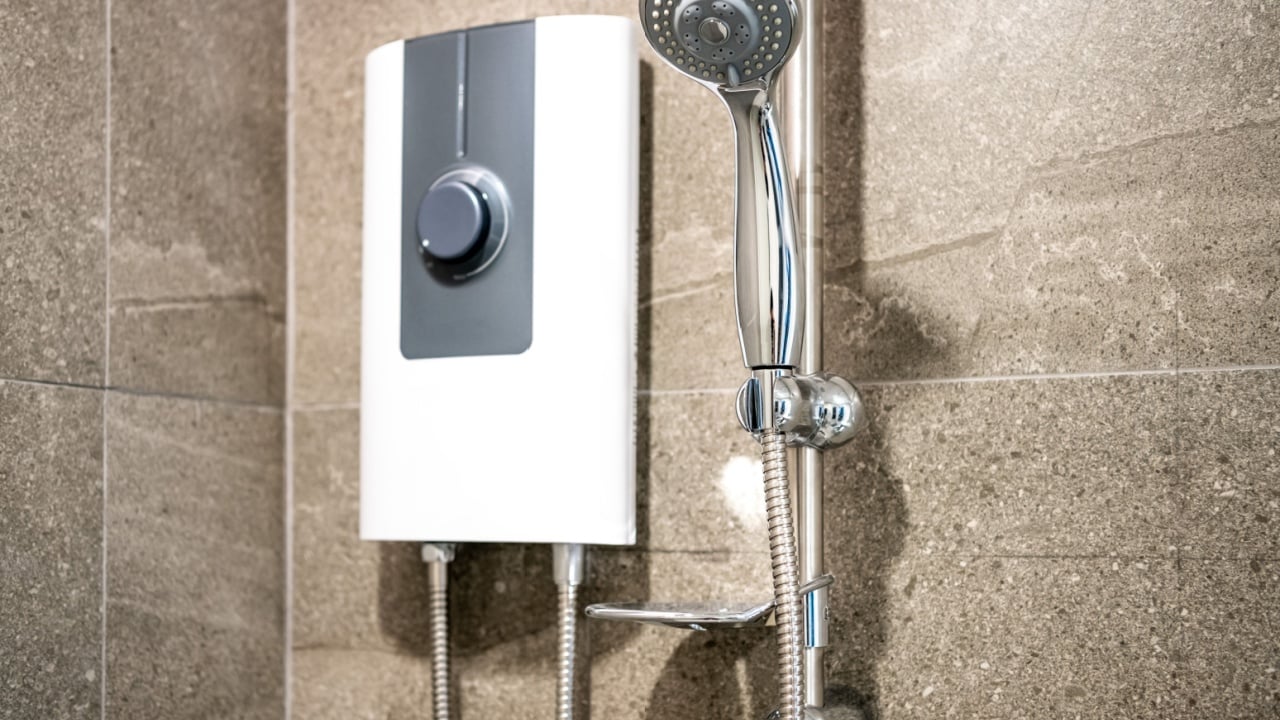 Shower and electric water heater in the bathroom