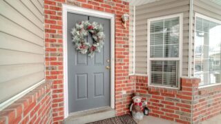 Christmas decorations on a front door of a home