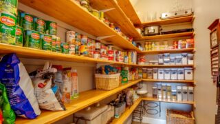 Keystone Heights, Florida / USA - May 24 2020: A well stocked large pantry with canned goods for the coronavirus