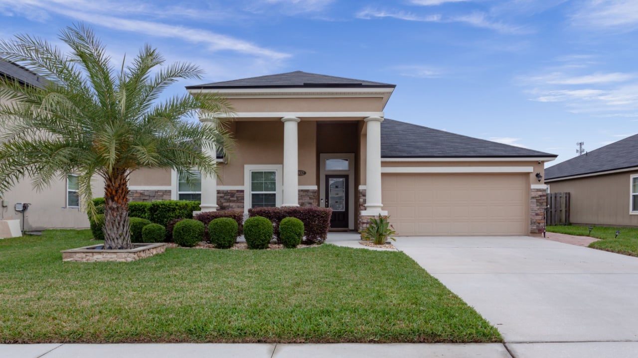 Jacksonville, Florida / USA - July 25, 2020: Large home with great curb appeal and palm trees out front