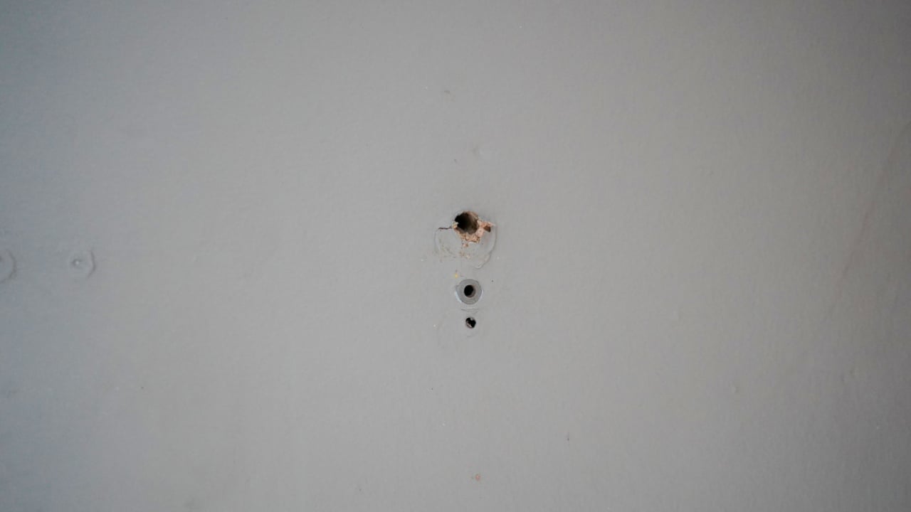 Small drill holes in a wall