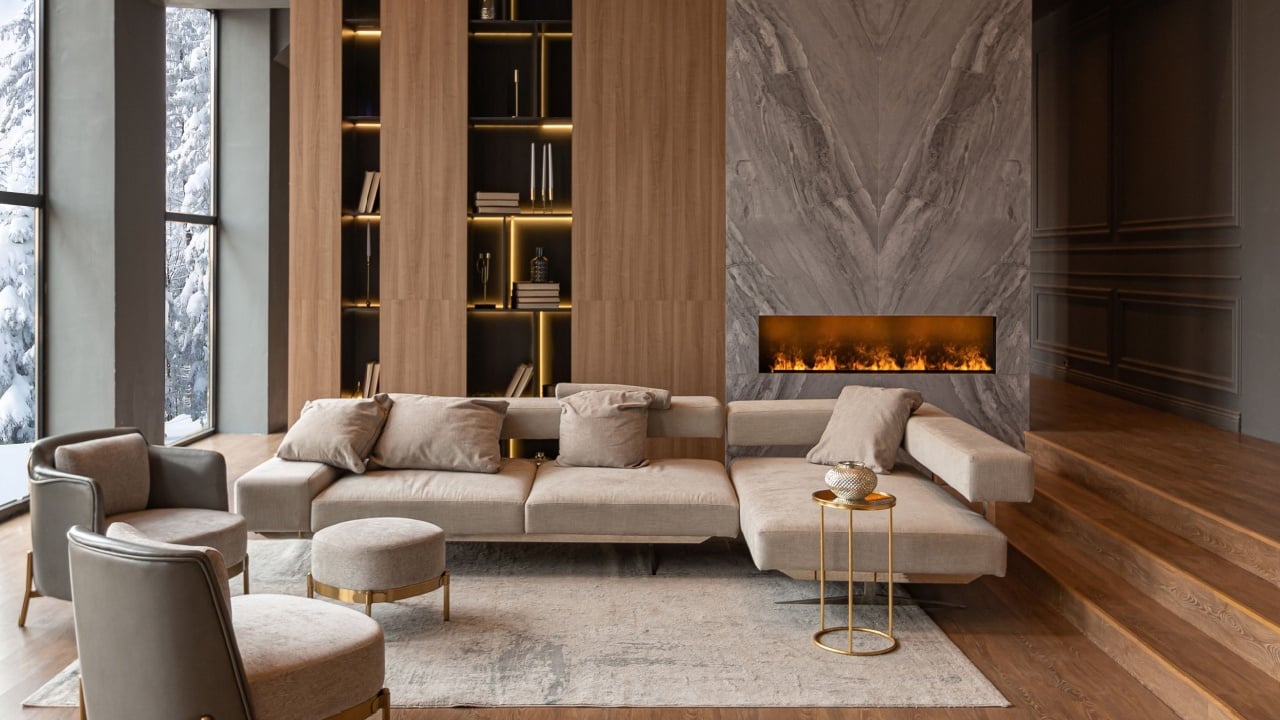 living room, marble wall fireplace and stylish bookcase to the ceiling in a chic expensive interior of a luxurious country house with a modern design with wood and led light, gray furniture