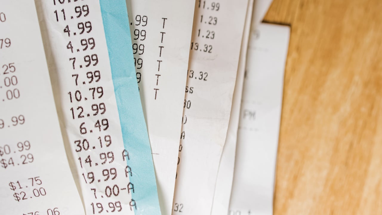 Close-up of receipts from different stores. Accounting, taxes, cost of living