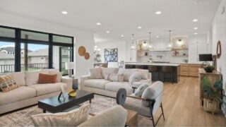 OMAHA, NE USA - 06-29-24 - Luxury open concept living room and kitchen with high end interior design features and transitional modern decor