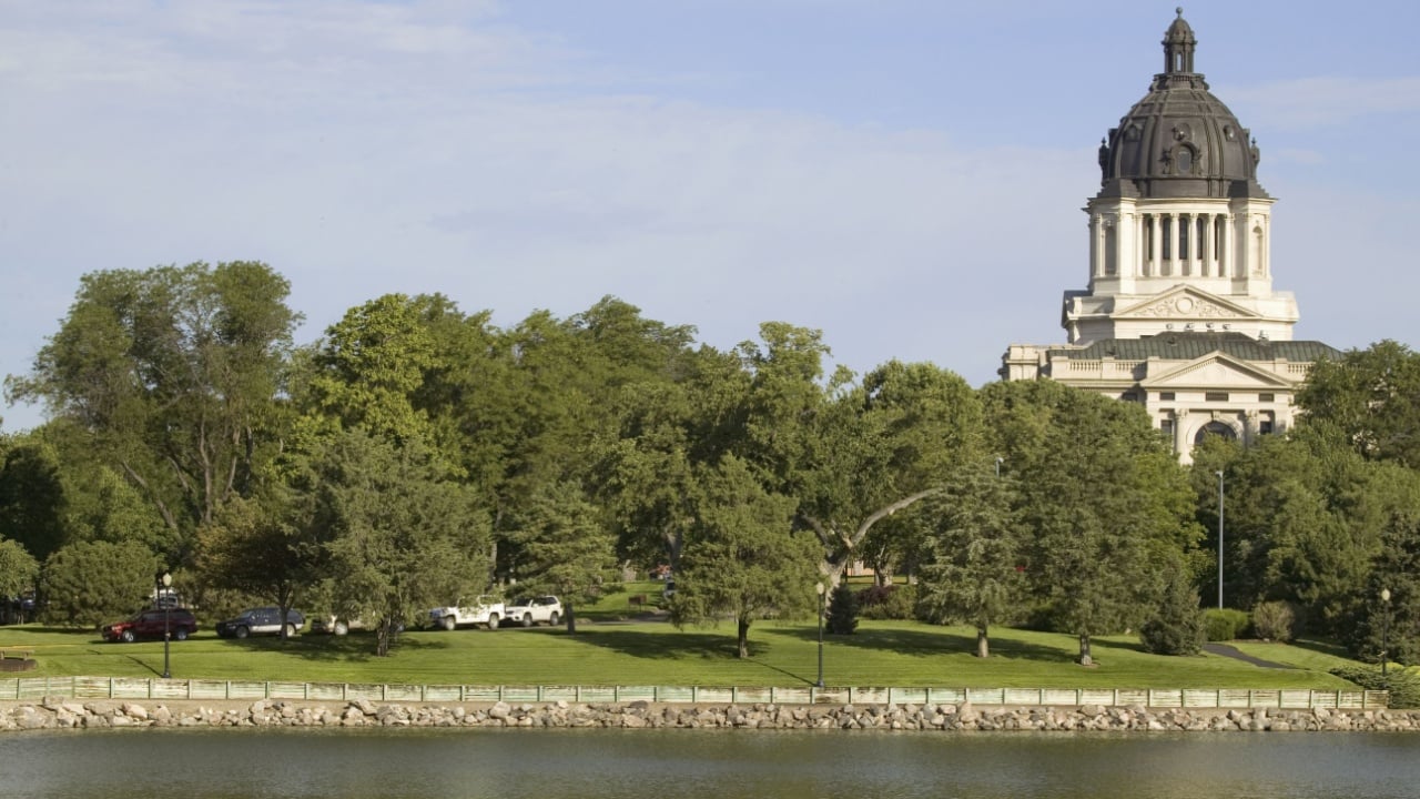 Lake with view of South Dakota State Capitol and complex, Pierre, South Dakota, built between 1905 and 1910
