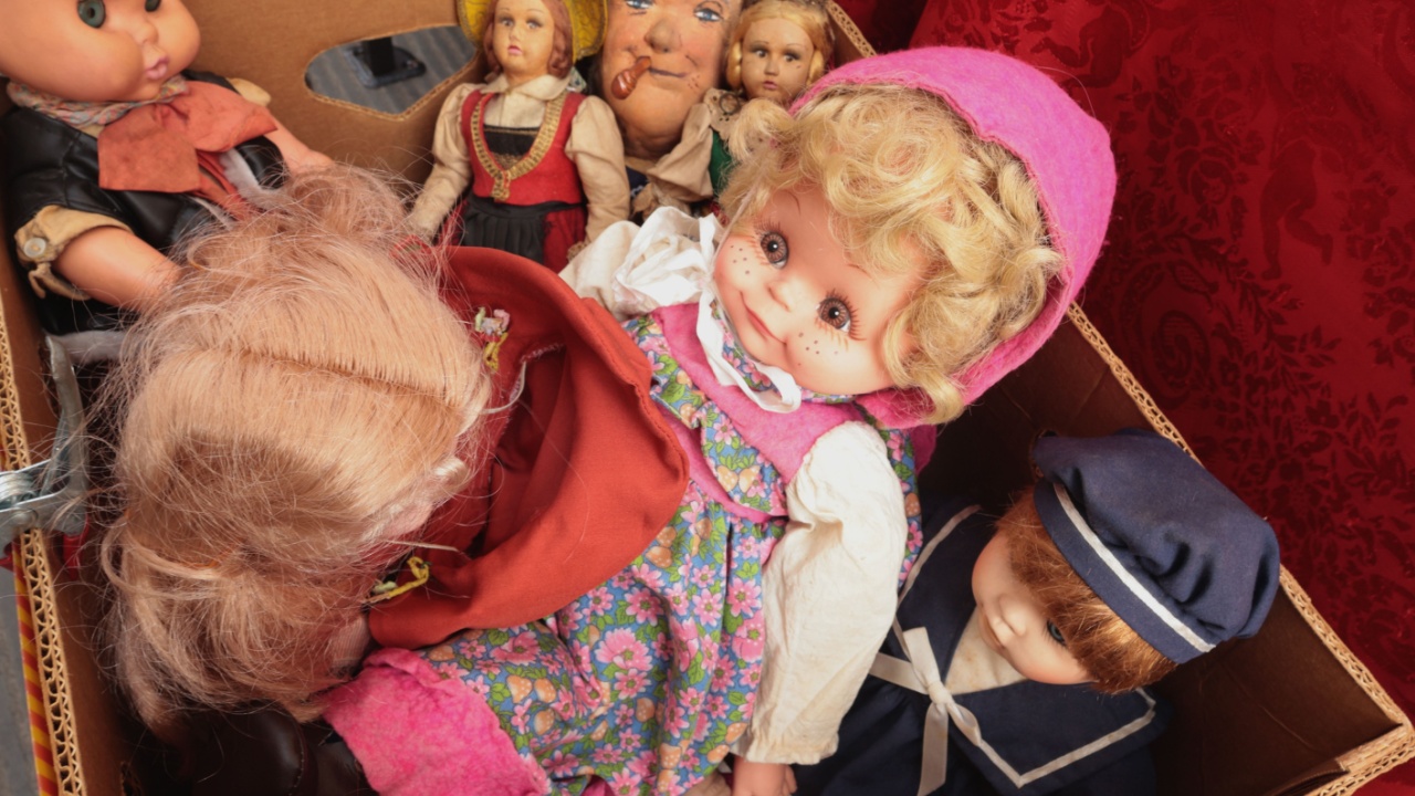Chiaveri, Italy - September 13, 2025. Flea antique market in Europe, Italy. Old vintage items. Toys, doll in box in town. Retro objects for design.