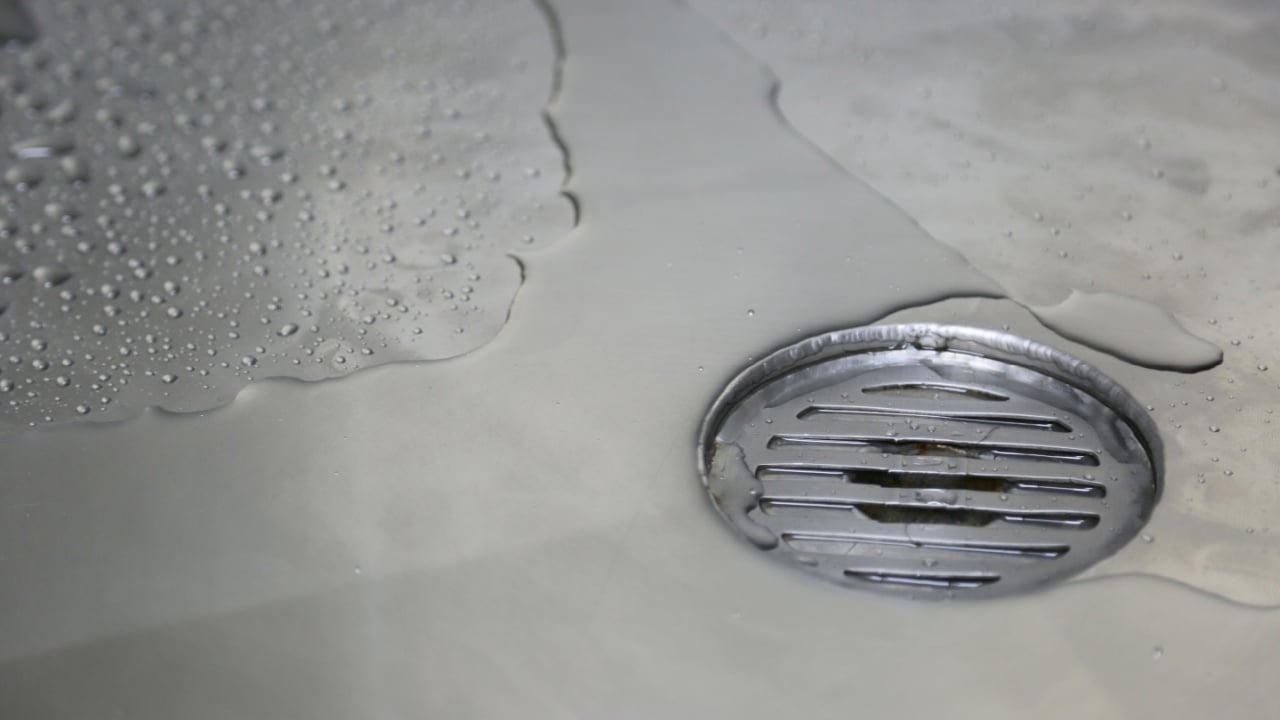 Water flow into drain bathroom.