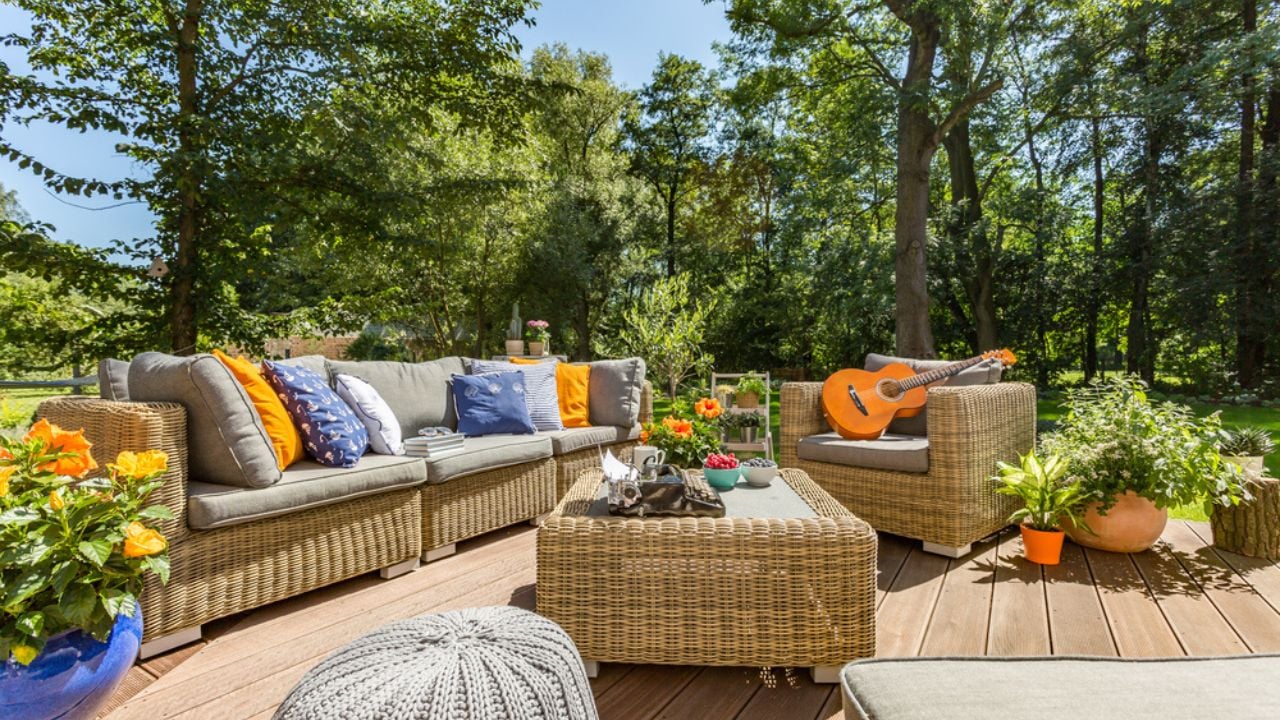 Spacious villa patio with comfortable stylish rattan furniture set