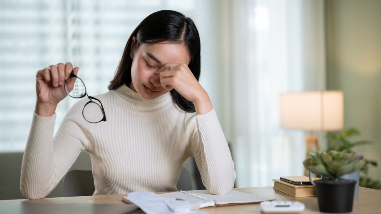 stressed woman budget receipt finance money