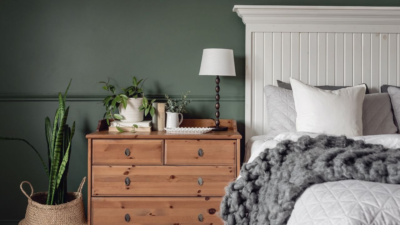 Interior green boho bedroom with plants and copy space