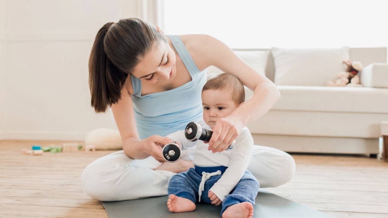 Woman with baby child playing together
